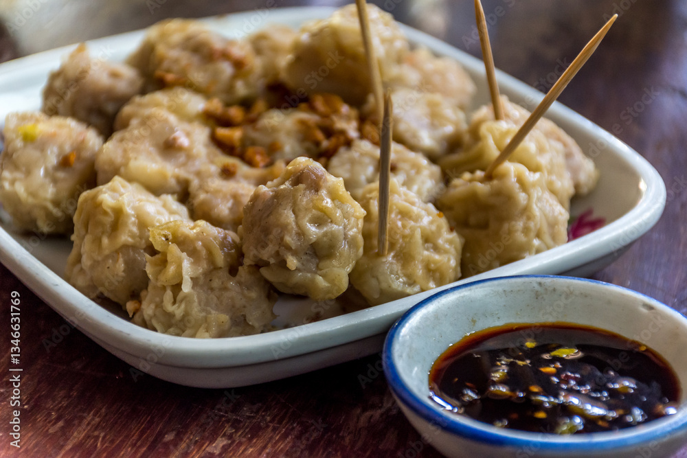 Chinese steamed dumplings (Dim Sum) with sauce Chinese steamed dumplings (Dim Sum) with sauce