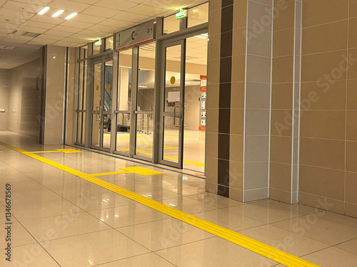 Tactile paving of a path for the blind with disabilities. Yellow indoor track for blind people