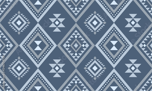 Aztec Navajo tribal Native American geometric seamless pattern. Colorful ethnic design for fabric, textile, blanket, rug, carpet, and fashion.