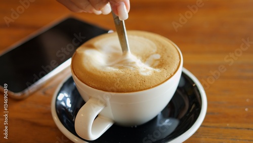 Photography Relaxing moment of stirring invigorating cappuccino before work coffee foam swir
