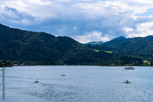 Idyllic panorama view of Tegernsee lake with Bavarian alps in background on a sunny summer day, Tegernsee, Bavaria, Germany