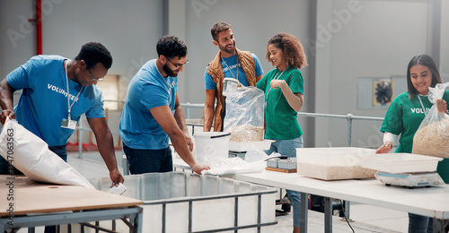 Volunteer, group and packing food for charity with community service, NGO outreach or donation support. Non profit foundation, people and happy with oats parcel in warehouse for social responsibility photo