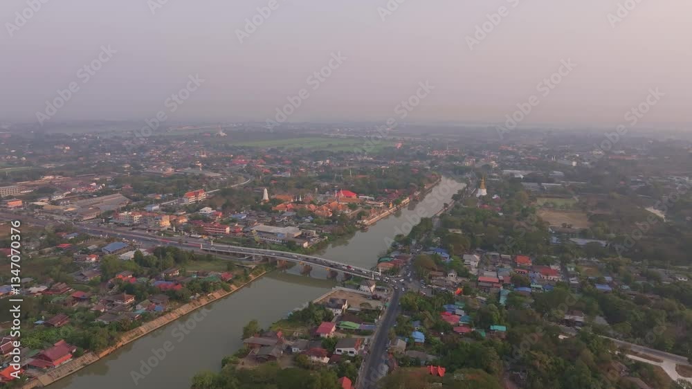 Drone shot of bridge stretching over Menam River at sunrise, Ayutthaya, Thailand. Aerial drone video Drone shot of bridge stretching over Menam River at sunrise, Ayutthaya, Thailand. Aerial drone video