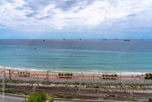 Beautiful panorama view of Balearic Mediterranean Sea and Playa El Milagro (Platja del Miracle) beach near train station of Tarragona in summer, Catalonia, Spain