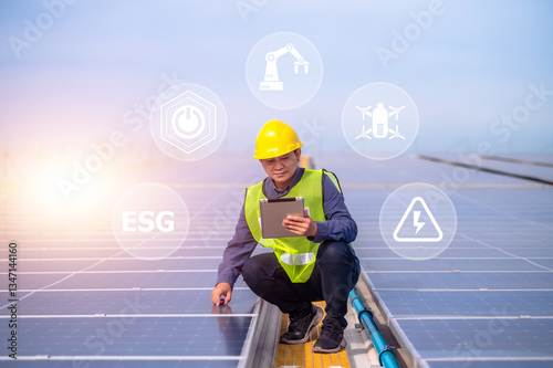 Obraz na płótnie A solar energy engineer inspects photovoltaic panels using digital technology to drive a sustainable future with ESG standards.
