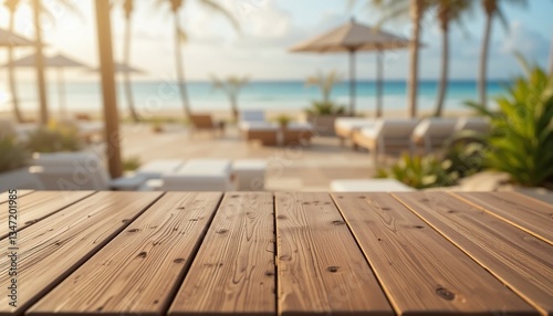 Fototapeta Naklejka Na Ścianę i Meble -  Empty wood table top on Luxury Beach Club with a blurred background. The focus is on the table surface.