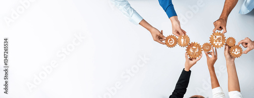 Cuadro en lienzo A diverse group of hands actively collaborates to assemble gears, symbolizing teamwork and effective project management in a dynamic business environment