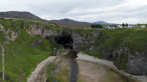 Smoo Cave in Scotland is a dramatic sea cave carved into limestone cliffs, where a waterfall thunders into darkness. A place of mystery, natural wonder, and ancient legends shaped by sea and time