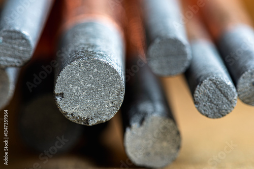 Fototapet Copper-plated carbon electrode, bundle of rods made from rare earth materials