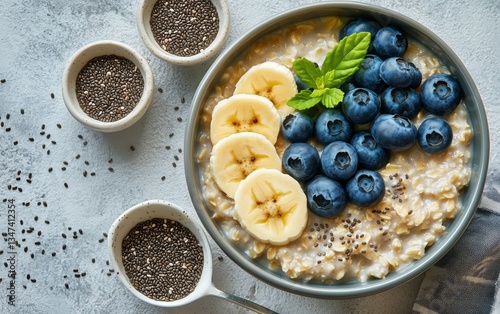 Healthy Breakfast Bowl With Oatmeal, Bananas, Blueberries, and Chia Seeds Ser...