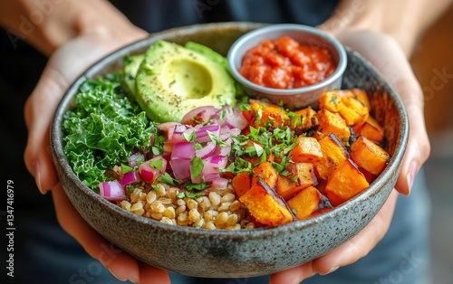 Hands Presenting a Nutritious Grain Bowl Featuring Roasted Vegetables, Greens...