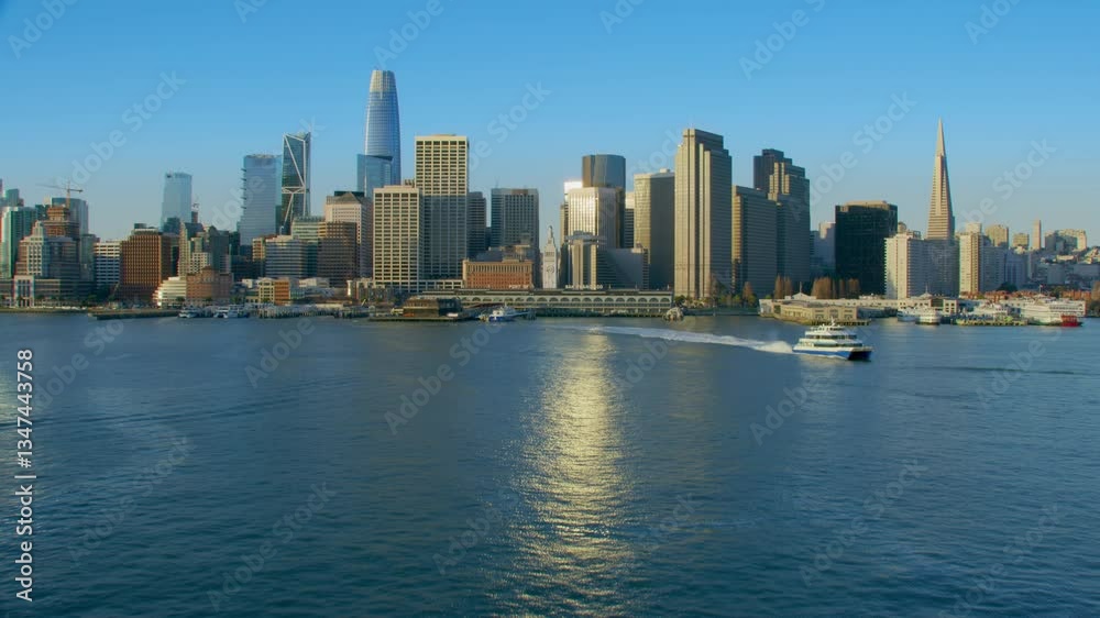 Aerial view of the San Francisco Ferry building with its clock tower. Famous buildings and piers. Financial District. Shot in 8K. California, United States. Aerial view of the San Francisco Ferry building with its clock tower. Famous buildings and piers. Financial District. Shot in 8K. California, United States.