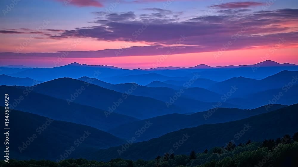 Serene mountain range landscape at sunset displaying vivid pink and purple hues perfect for background footage Serene mountain range landscape at sunset displaying vivid pink and purple hues perfect for background footage