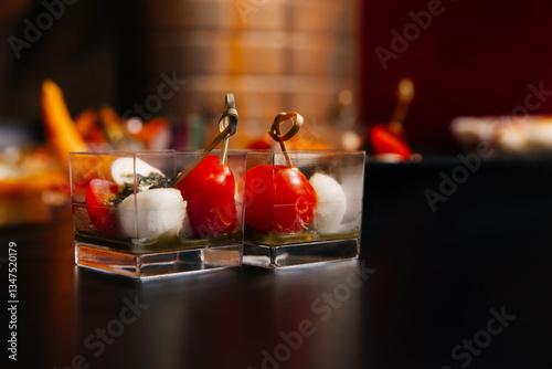 Two servings of La Caprese - a combination of fresh tomatoes, delicate mozzarella, fragrant dried basil and olive oil.