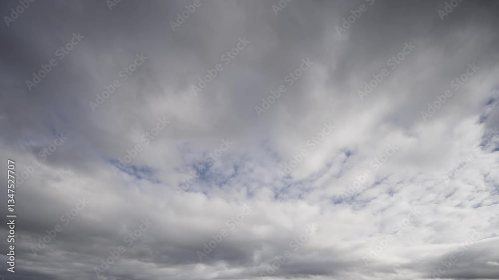 Dynamic cloud movement over a daytime sky