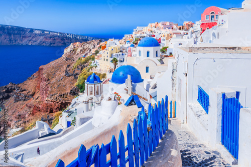 Oia, Santorini. Beautiful village with whitewashed houses, blue-domed churches and caldera views overlooking the Aegean Sea, Greece.