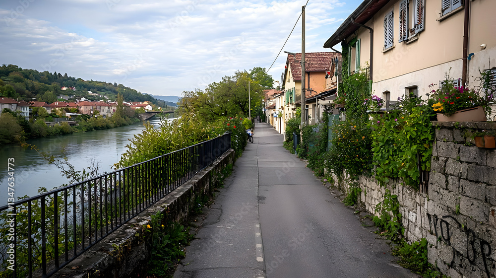 Quaint European Alleyway With Stone Buildings Overlooking River Under Cloudy Sky