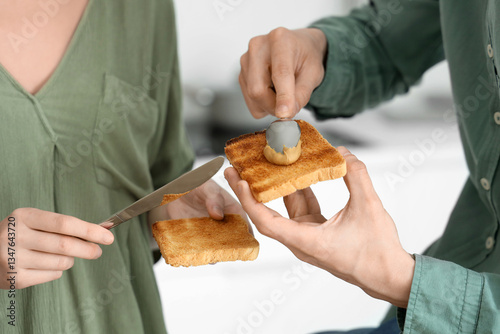 Couple preparing breakfast ...