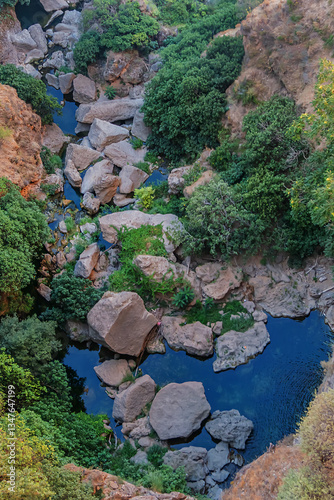 The rocky, sheer-sided limestone cliffs of Ronda Gorge (El Tajo de Ronda) plummet 390 feet (120 meters) to Guadalevin River. Ronda, Province of Malaga, Spain.