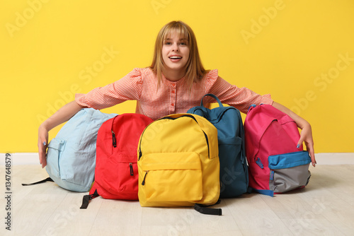 Happy young student girl wi...