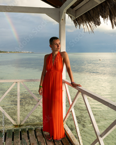 Photography Tourist enjoying rainbow over the ocean in cayo guillermo, cuba