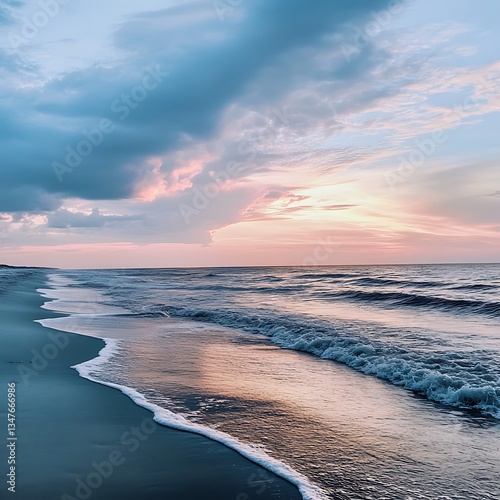 Calm ocean waves glowing beneath the setting suns golden rays image