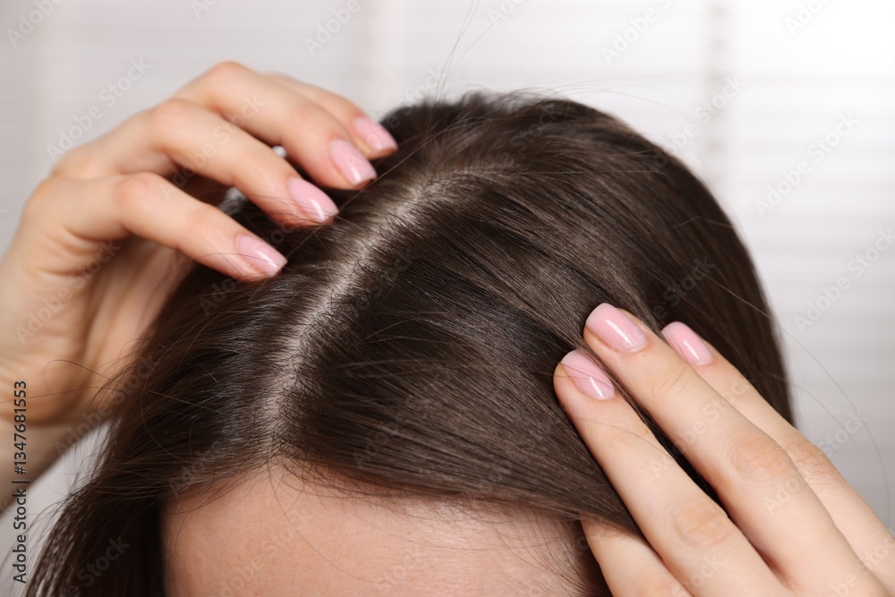 Woman with healthy hair roots on blurred background, closeup Woman with healthy hair roots on blurred background, closeup