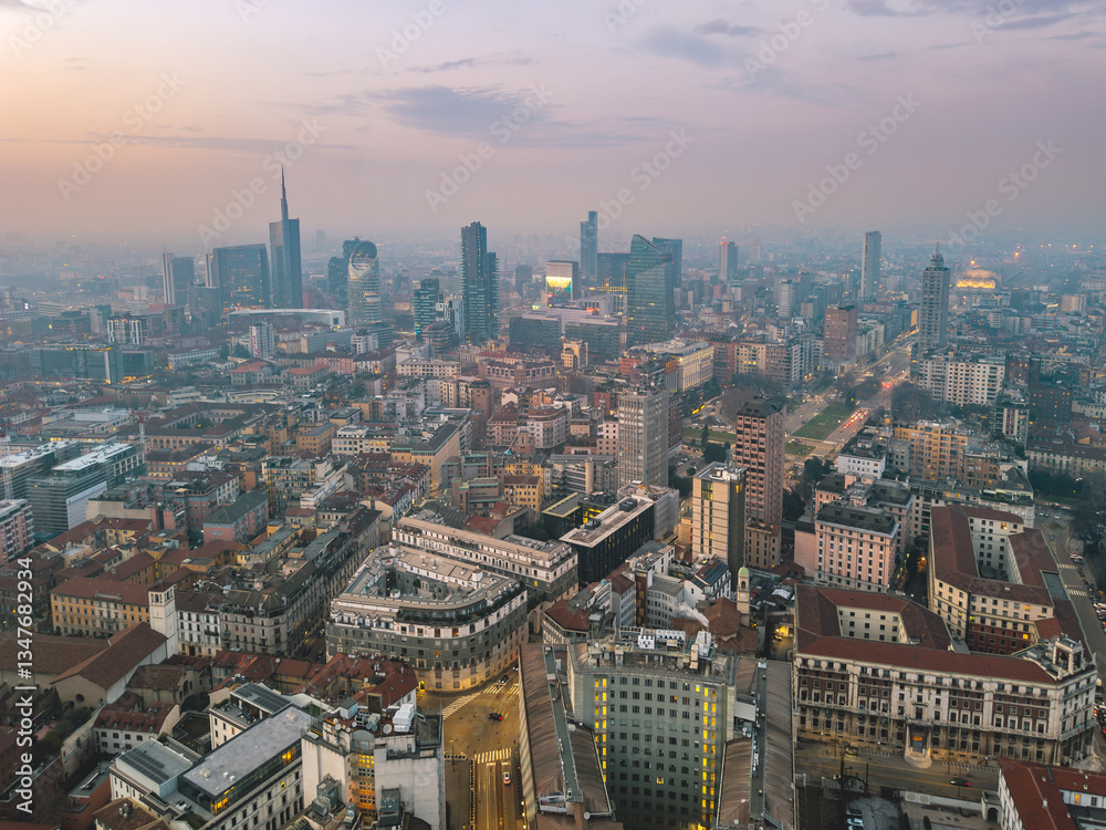 Fototapeta premium Twilight aerial drone view of Milan’s Porta Nuova and Porta Garibaldi