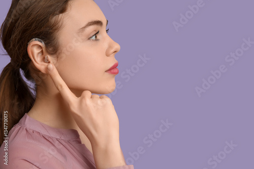 Beautiful young woman point...