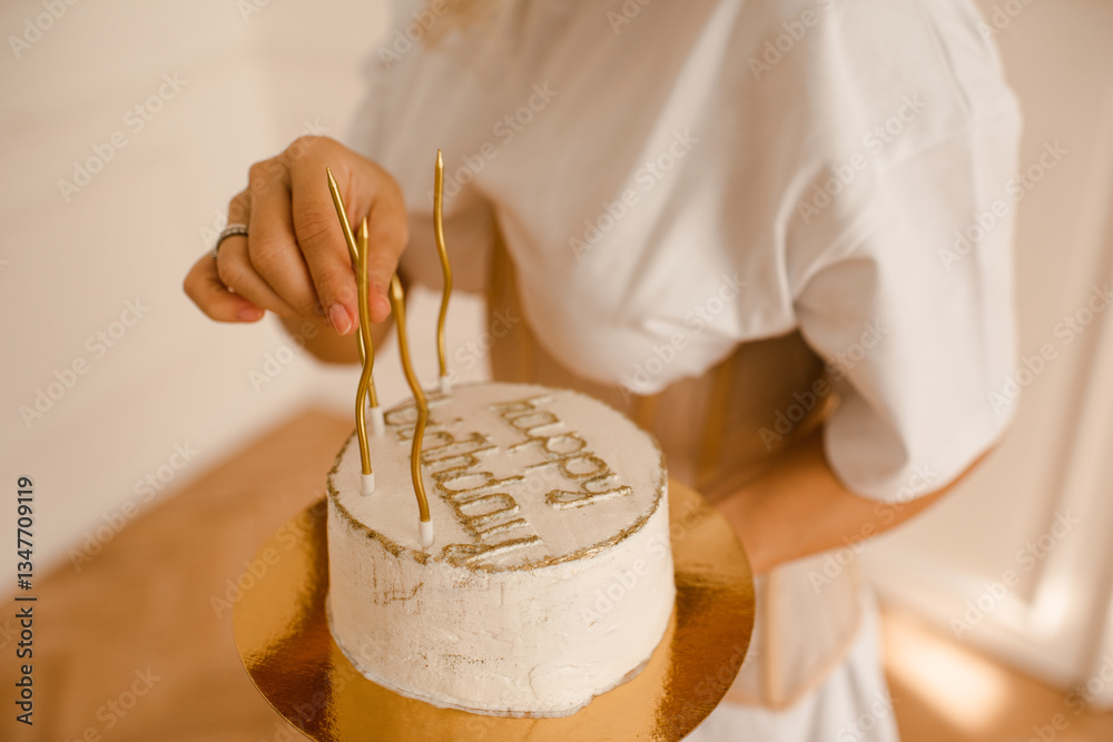 Fototapeta premium Woman holding birthday bento cake with candles closeup. Celebration.