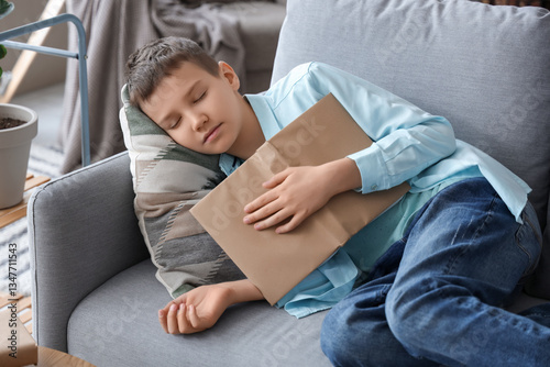 Teenage boy sleeping with b...
