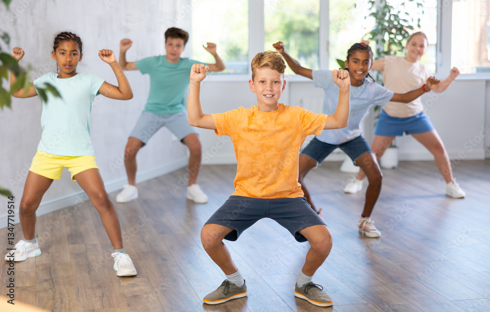 Obraz premium Dance studio - happy girls and boys in dance lesson