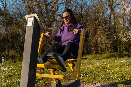 Wallpaper Mural beautiful middle-aged woman in sportswear doing sports training in an outdoor park Torontodigital.ca
