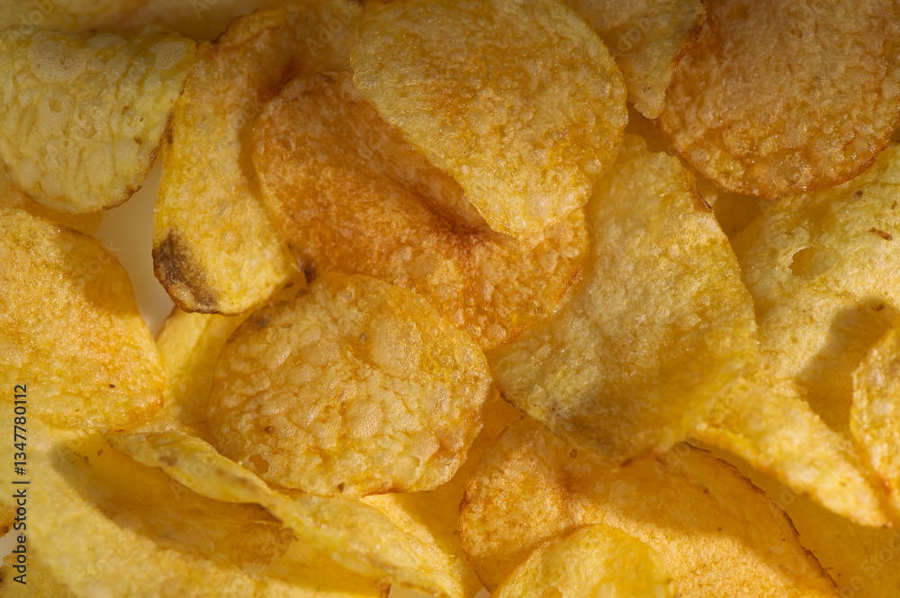 Crispy golden potato chips ready to satisfy snack cravings during a relaxing afternoon Crispy golden potato chips ready to satisfy snack cravings during a relaxing afternoon