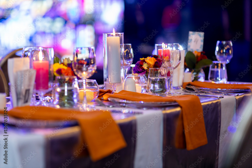 Elegant dinner table setting with candles and flowers