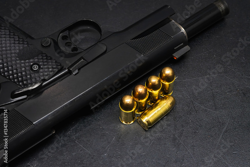 45 caliber pistol and cartridges. Self-defense weapon.