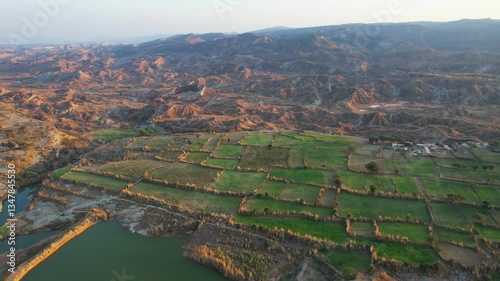 Aerial view of village between hills in Chakwal, Pakistan.