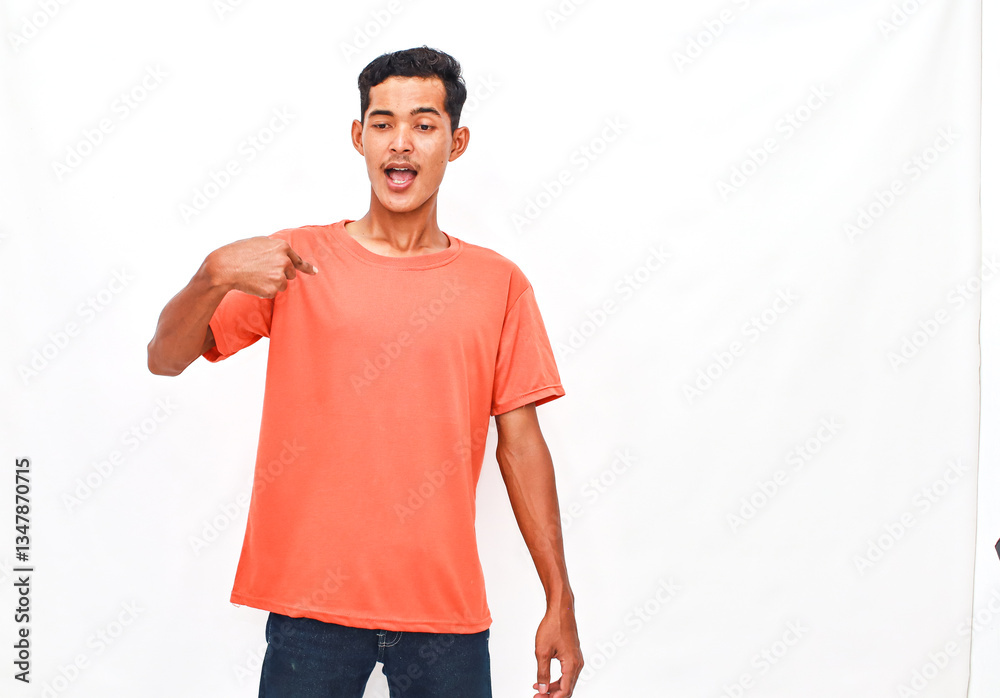 Fototapeta premium Young Person in Vibrant Top Pointing at Themself Against Plain Background