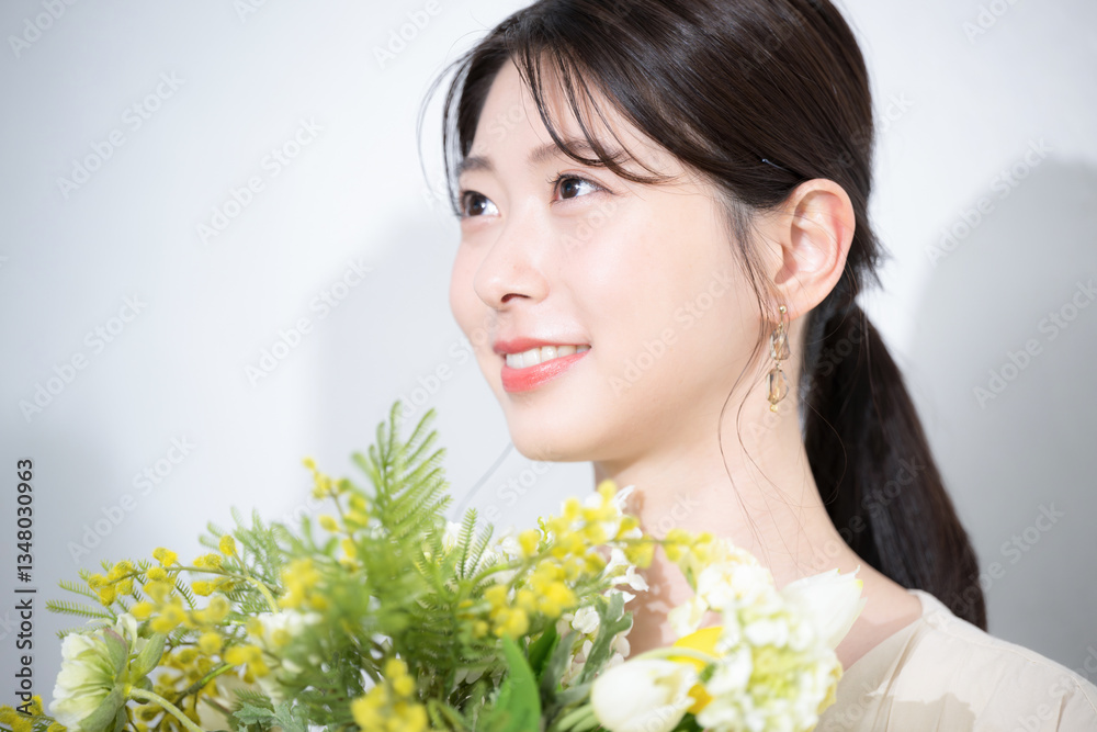 Profile of a beautiful beauty image of spring and summer yellow flowers holding a bouquet of mimosa, beauty, marriage, etc. Profile of a beautiful beauty image of spring and summer yellow flowers holding a bouquet of mimosa, beauty, marriage, etc.