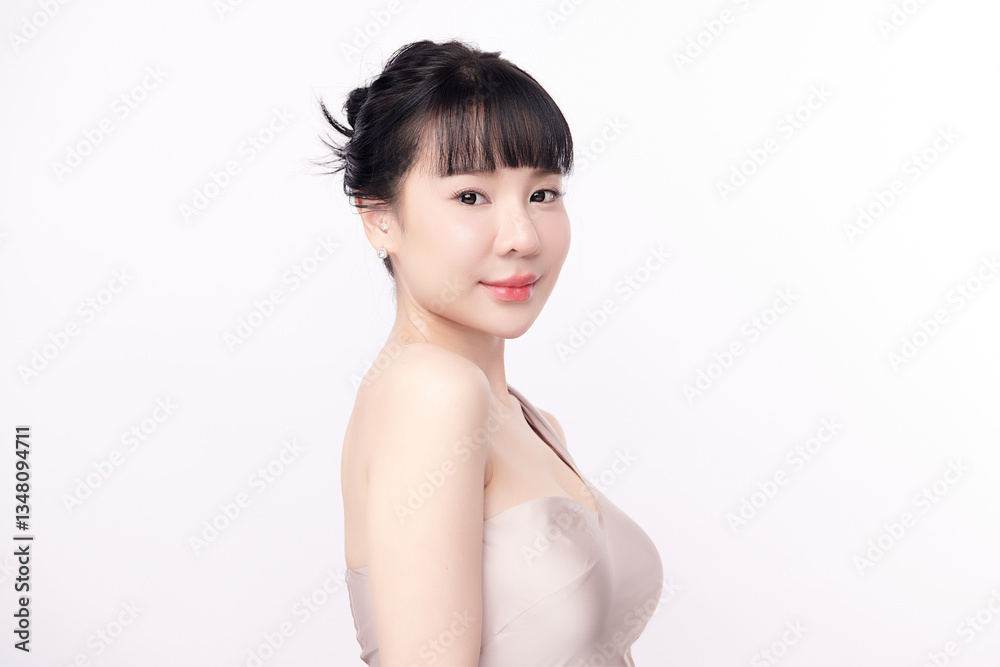 A beautiful young Asian woman with clean, fresh skin against a white background. Skincare, facial treatment, cosmetology, beauty, and spa. An elegant portrait of an Asian woman. A beautiful young Asian woman with clean, fresh skin against a white background. Skincare, facial treatment, cosmetology, beauty, and spa. An elegant portrait of an Asian woman.