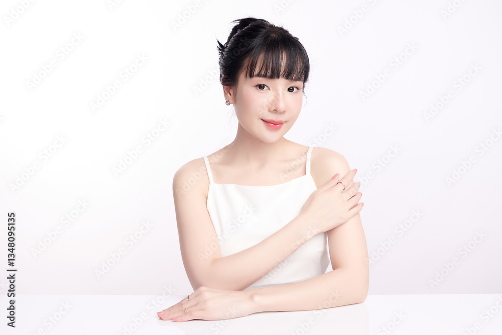A beautiful young Asian woman with clean, fresh skin against a white background. Skincare, facial treatment, cosmetology, beauty, and spa. An elegant portrait of an Asian woman. A beautiful young Asian woman with clean, fresh skin against a white background. Skincare, facial treatment, cosmetology, beauty, and spa. An elegant portrait of an Asian woman.