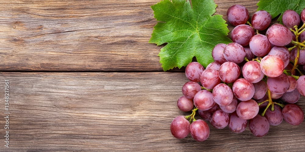 Fresh Purple Grapes with Green Leaves on Rustic Wooden Background Fresh Purple Grapes with Green Leaves on Rustic Wooden Background