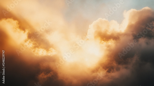 A breathtaking view of clouds illuminated by sunlight, creating a dramatic interplay of light and shadow in the sky.