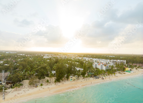 Fototapeta Naklejka Na Ścianę i Meble -  A beautiful beach with palm trees and a clear blue ocean