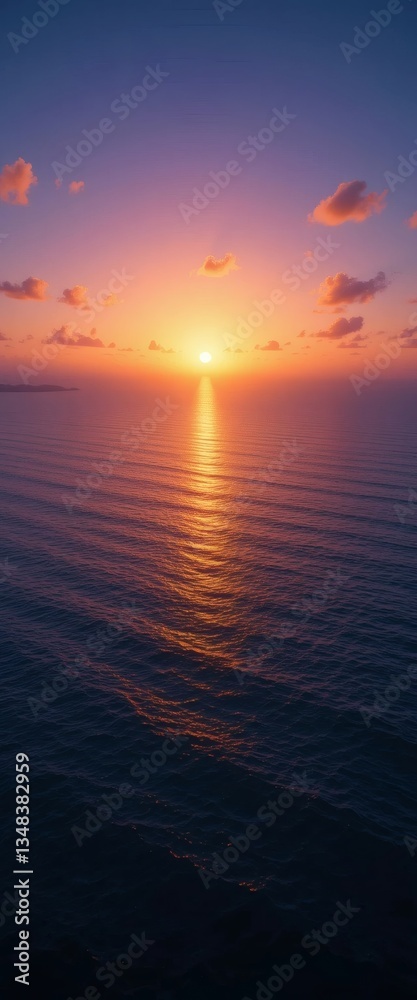 Fototapeta premium Vertical Sunset Over Calm Ocean Horizon with Fiery Sky