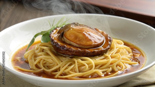 Delicate braised abalone atop warm, soft egg noodles with savory broth