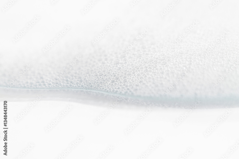 Obraz premium Foam for washing, mousse for hair on white background front view, cosmetic texture.