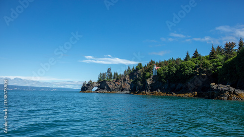 Lighthouse on Halibut Cove sea arch peninsula in Kachemak Bay near Homer Alaska USA photo
