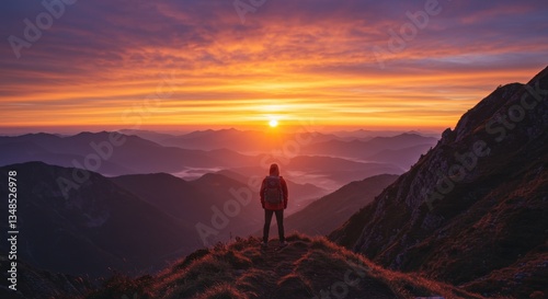 Solo traveler watching a dramatic sunset on the hills