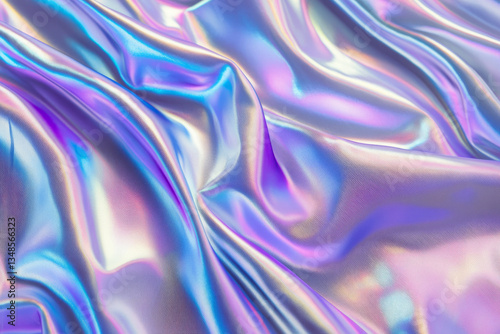 A futuristic holographic fabric texture background in iridescent blue, purple, and silver. The smooth, reflective surface changes colors with light angles, creating a mesmerizing, high-tech aesthetic,